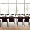 Institutional tables and chairs in a classroom setting
